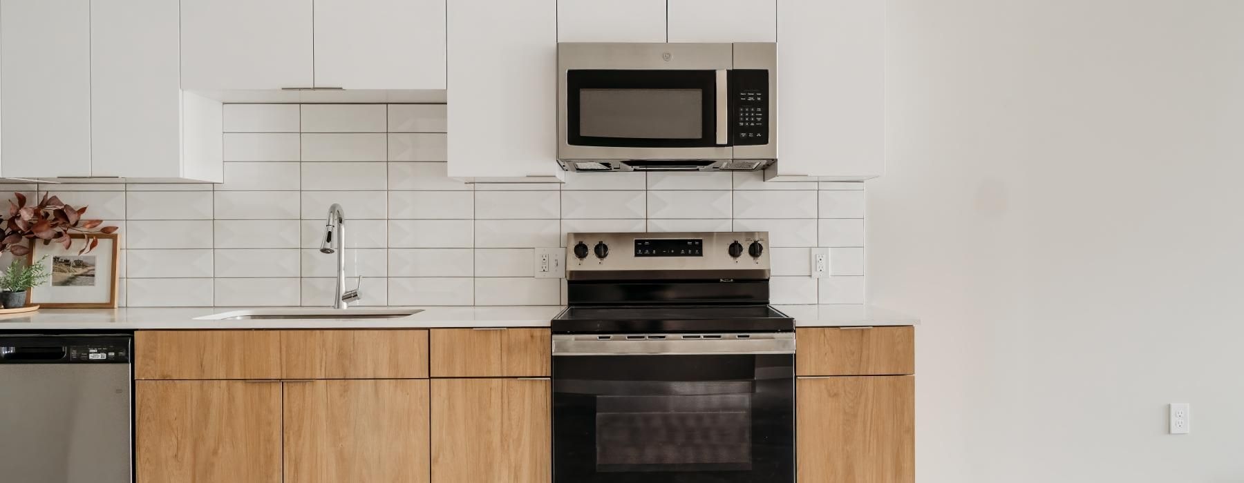 a kitchen with white cabinets