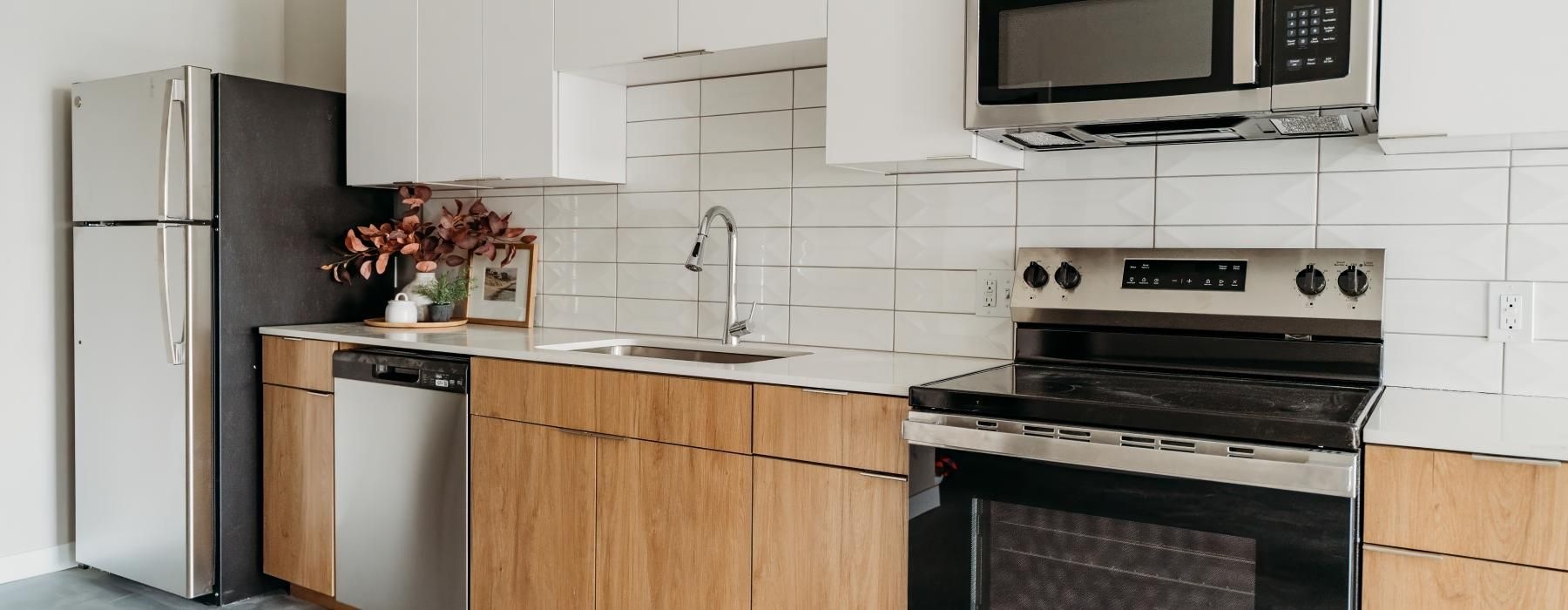 a kitchen with white cabinets