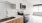 a kitchen with white cabinets at The Dial Apartments in Kansas City, MO